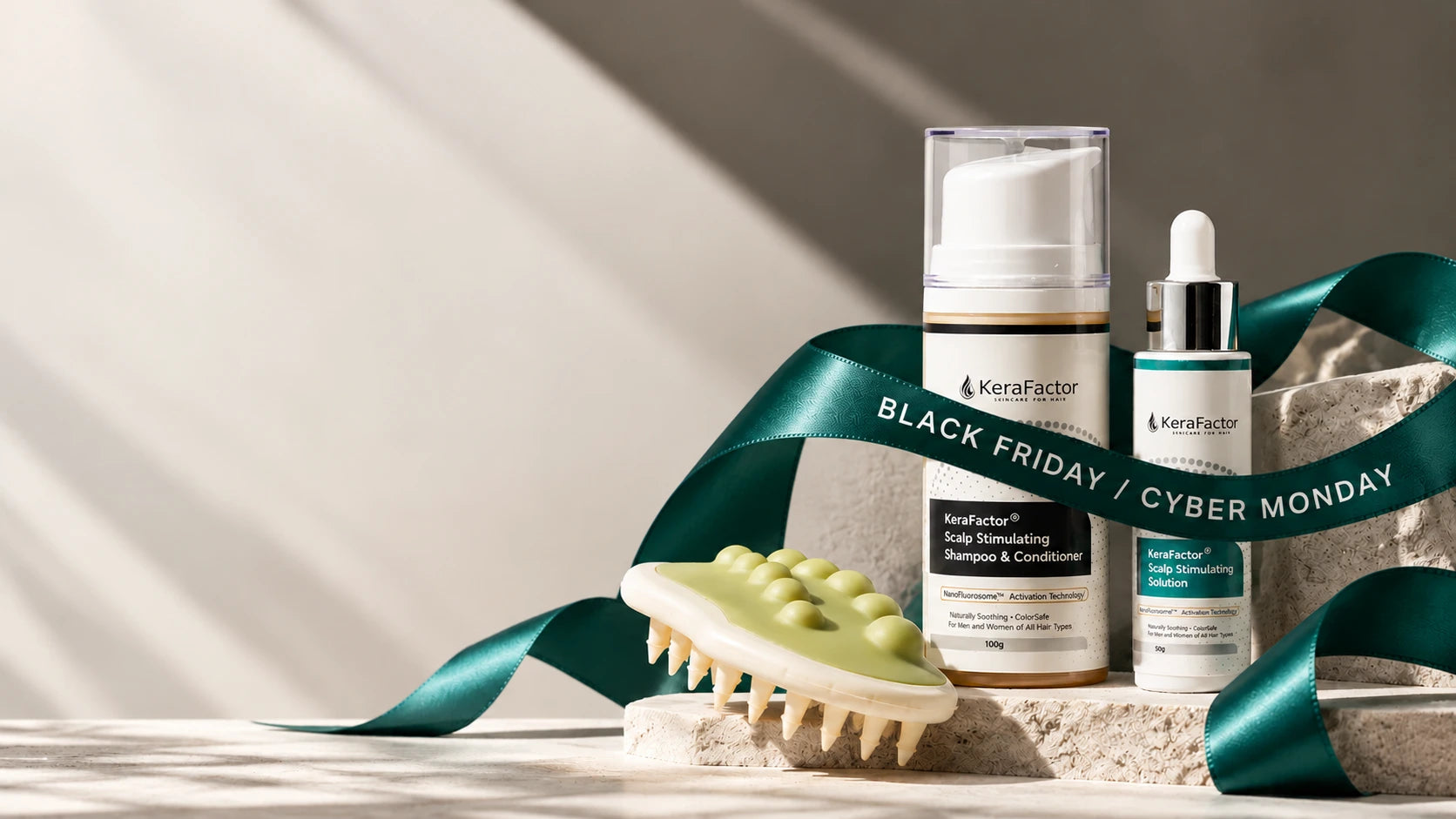 KeraFactor shampoo, scalp solution and scalp massager wrapped in a Black Friday / Cyber Monday ribbon